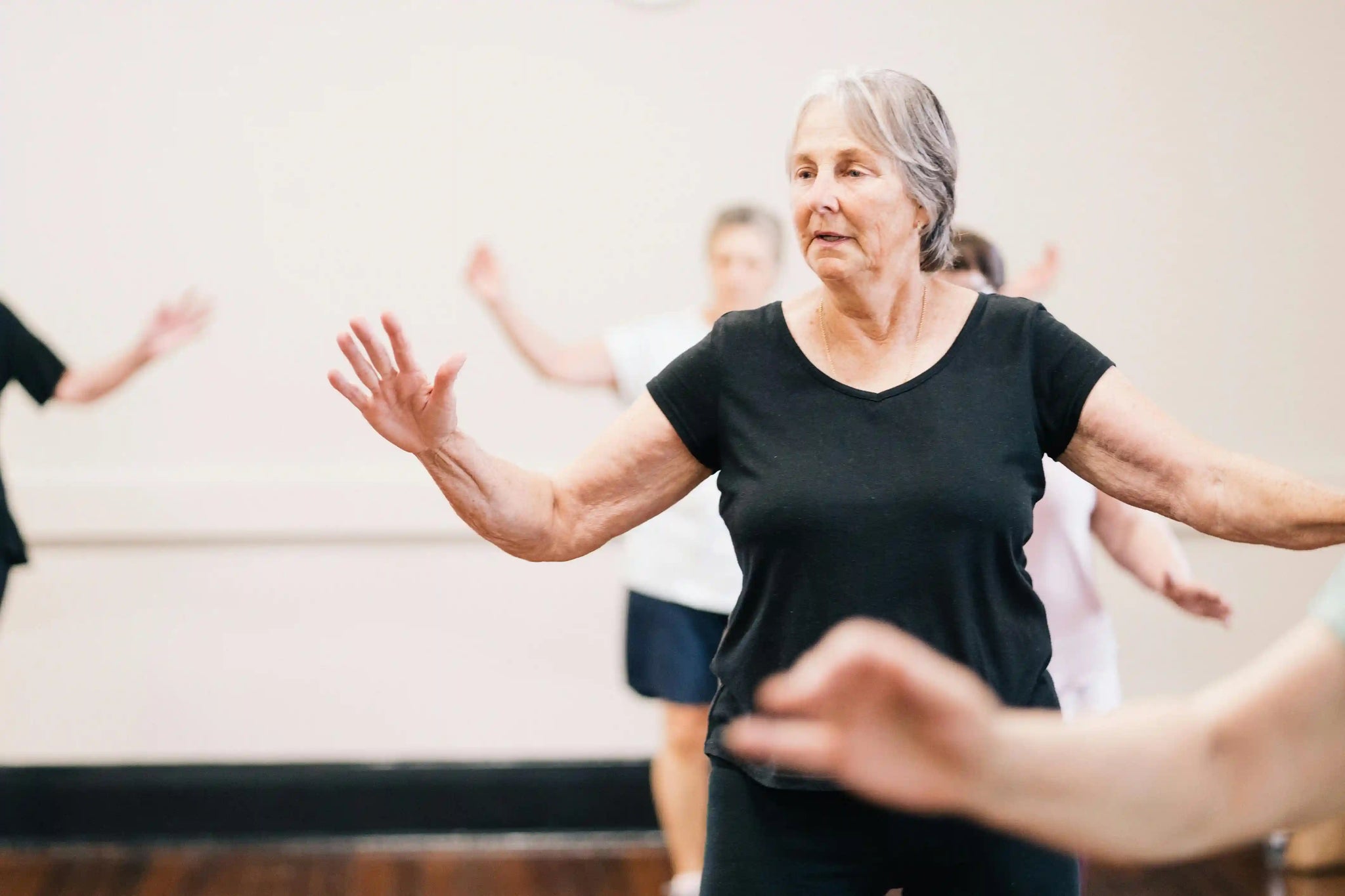 Elderly woman attending a dance class