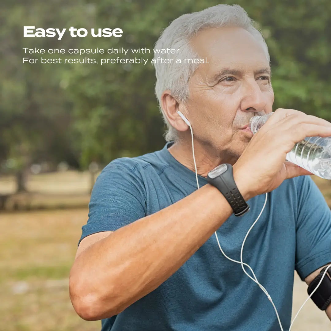 Man in a blue shirt drinking water outdoors, text reads "Easy to use: Take one capsule daily with water."