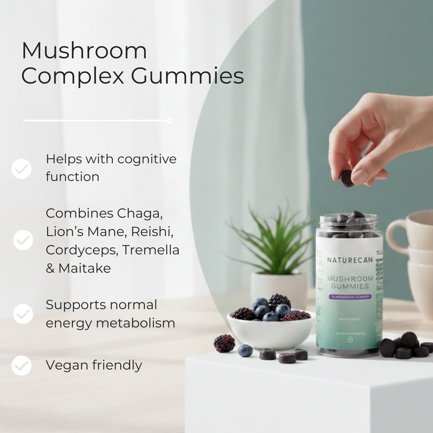 Naturecan mushroom complex gummies with a hand picking one, placed on a table with a blurred background.