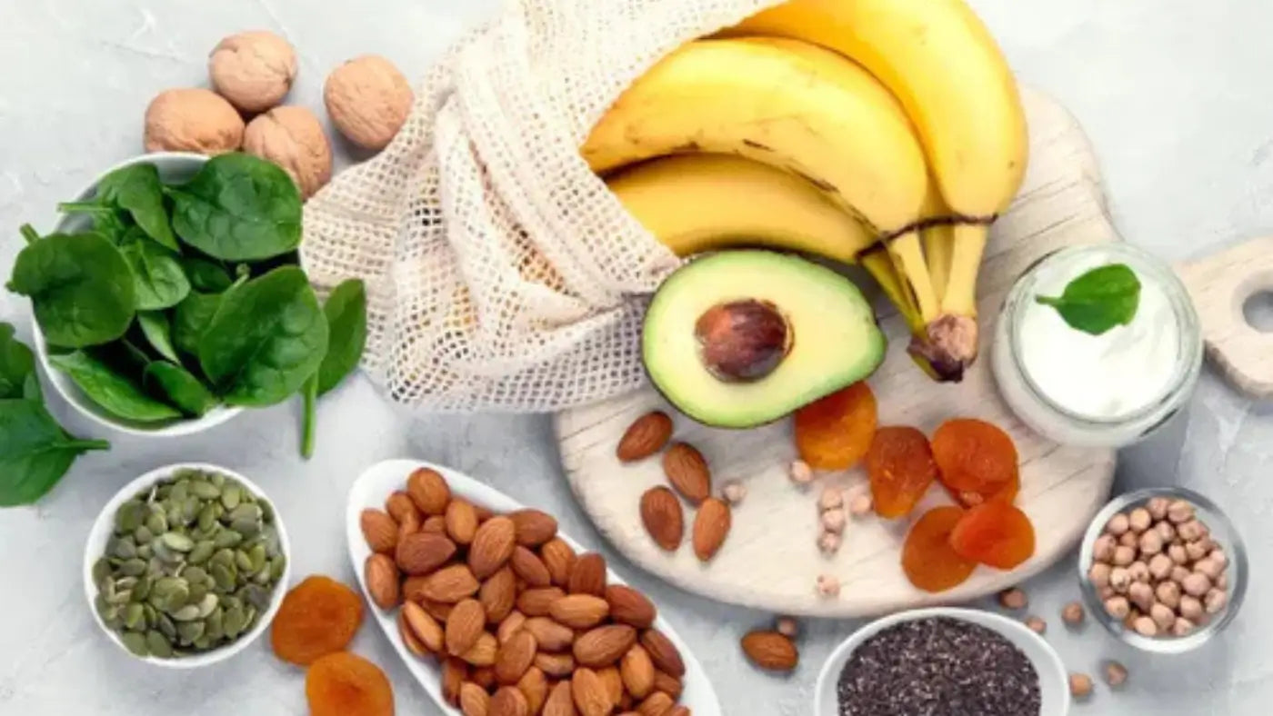 table with magnesium-rich foods (bananas, almonds, spinach, etc.)