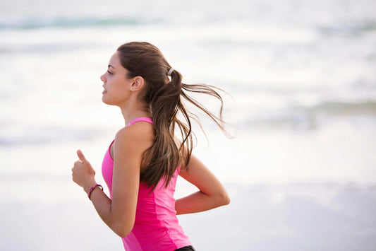 Woman running at the beach