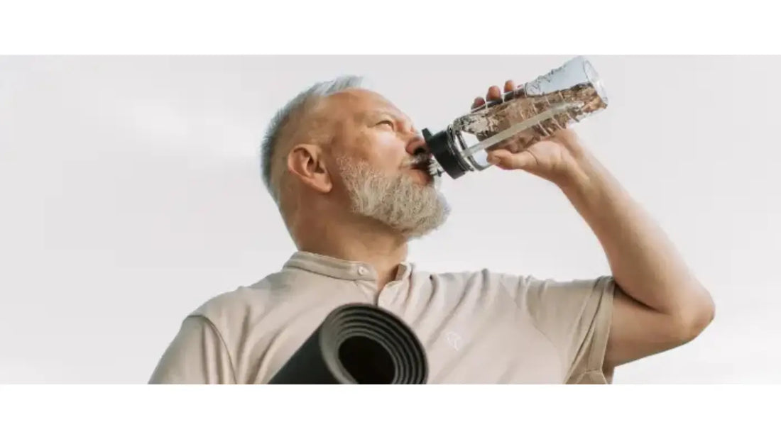 Guy drinking water after workout