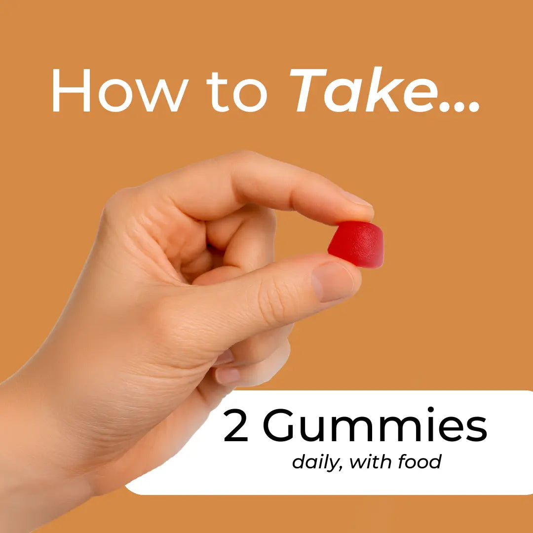 Hand holding a red gummy with text on an orange background