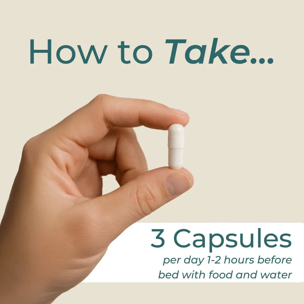 Hand holding a white capsule with text on how to take it, on a beige background