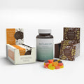 Naturecan CBD snack bundle with cookies, vegan gummies, and chocolate packaging.