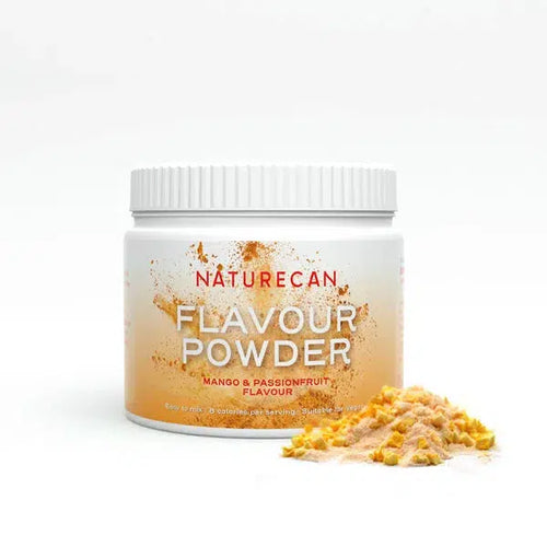 Naturecan mango and passionfruit flavor powder tub with scattered powder in the foreground.