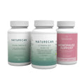 Three white Naturecan supplement bottles on a white background: Algae Omega-3, Vitamin D3 and K2, and Menopause Support.