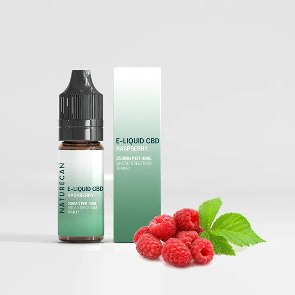Naturecan E-Liquid CBD Raspberry 250mg packaging with fresh raspberries beside the bottle and box.