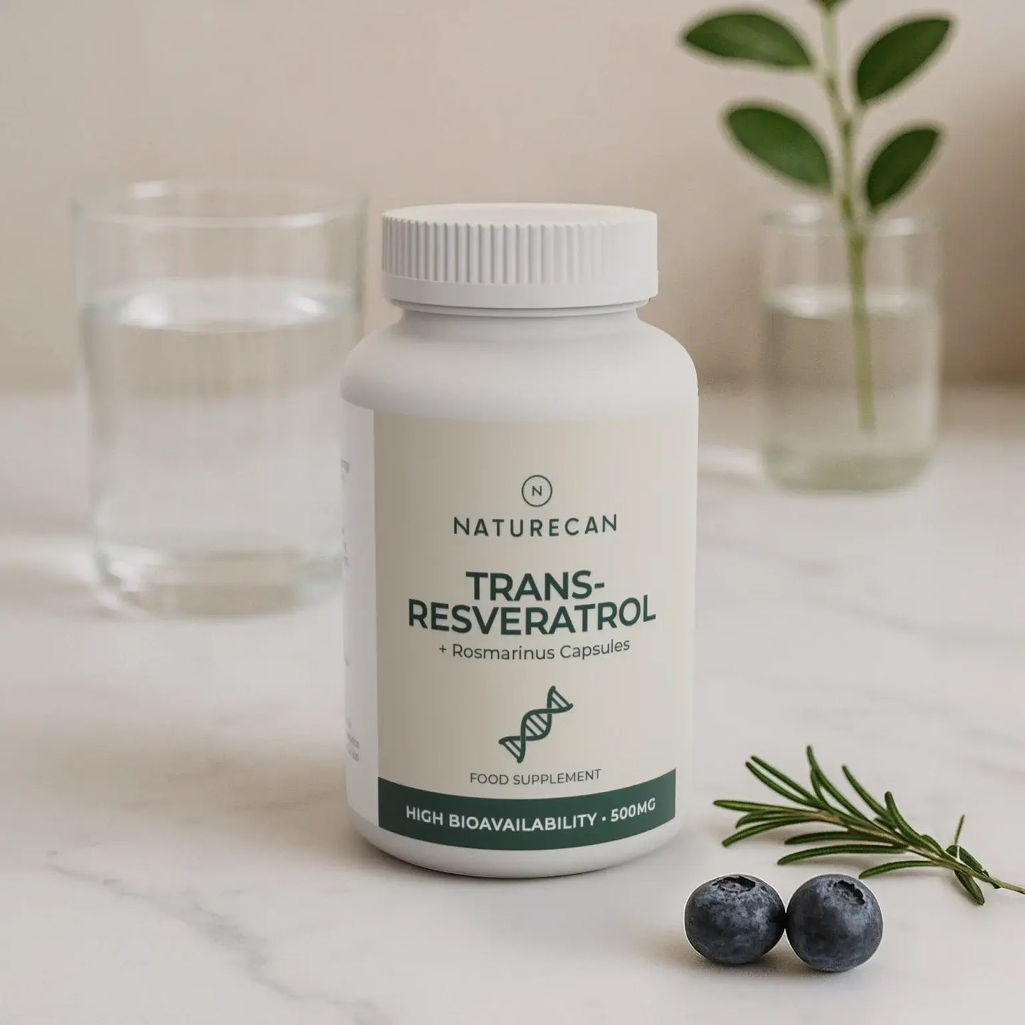 Naturecan Trans-Resveratrol capsules on a marble surface with rosemary, blueberries, and glass of water.