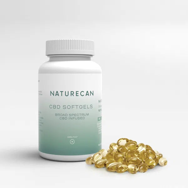 Naturecan CBD softgels bottle with scattered softgels, labeled broad spectrum CBD infused.