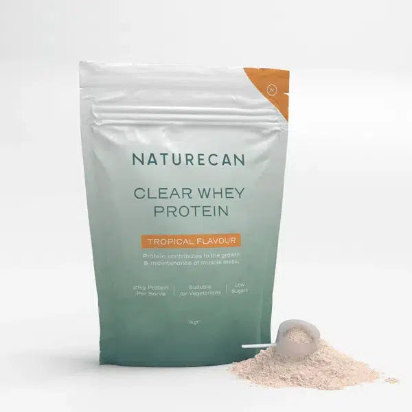 Naturecan Clear Whey Protein packaging in tropical flavor with protein powder and scoop.
