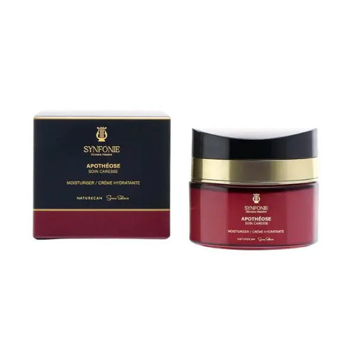 Red cosmetic jar with gold lid and black box labeled 'SYNFOINIE' on a white background