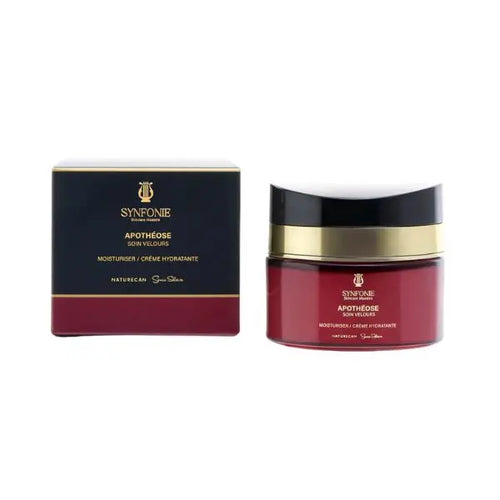 Red jar and black box with gold accents of Synfonie Apotheose on a white background