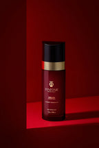 Red bottle with black cap on a red background