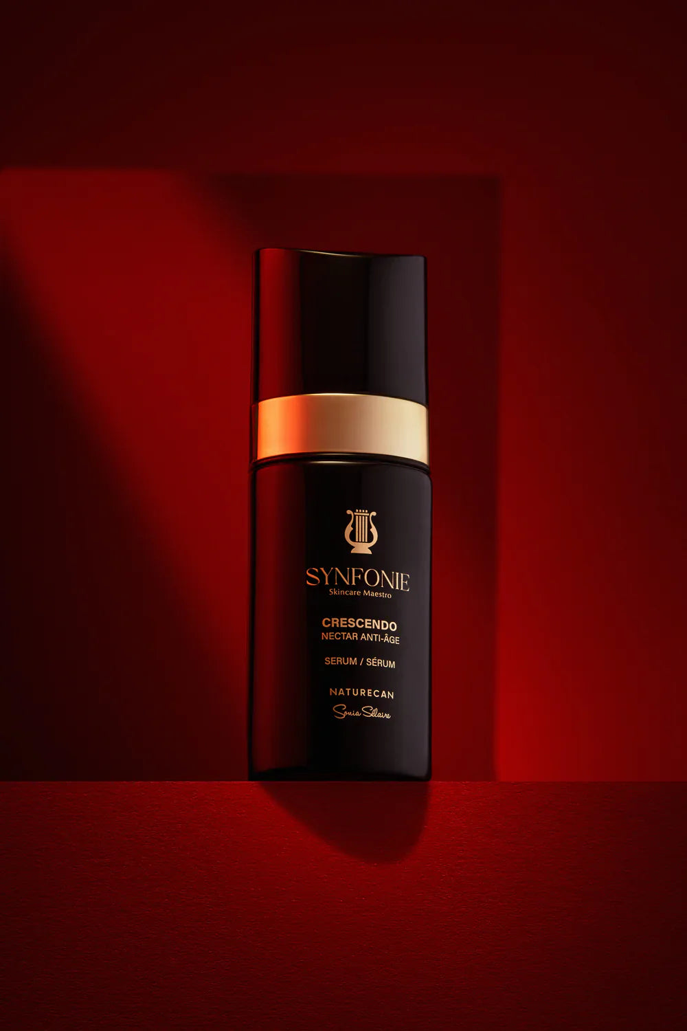 SYNFONIE skincare bottle on a red background